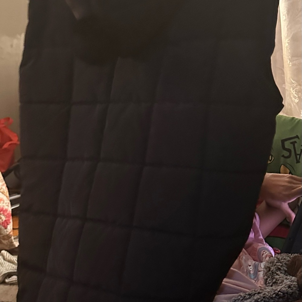Puffer vest with Pompoms on the pockets and hood